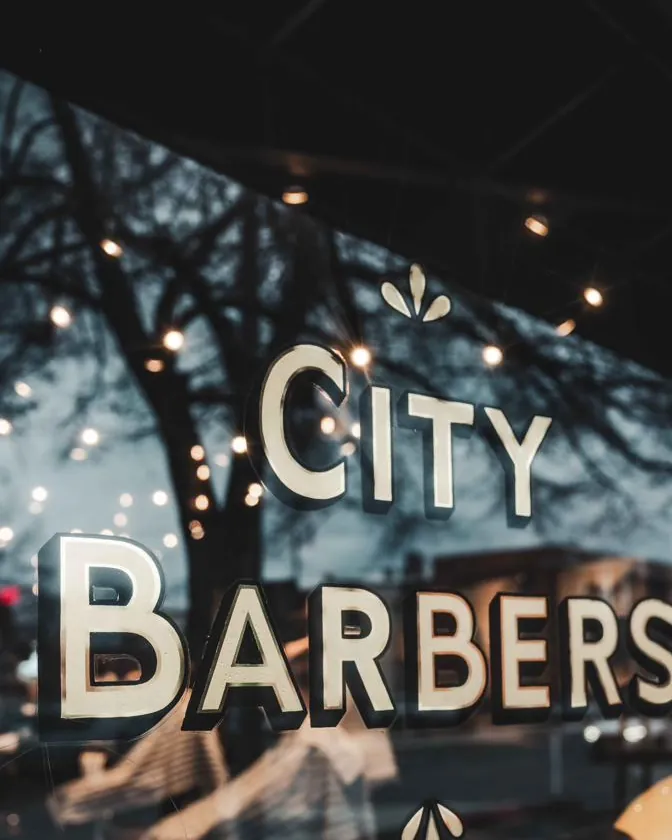 Gold City Barbers lettering on the front window