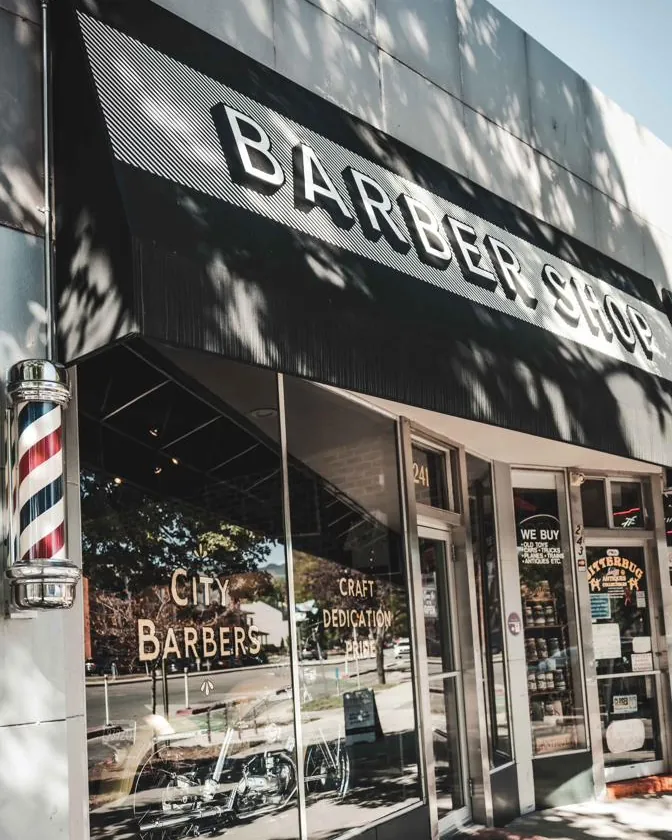 The City Barbers storefront and awning