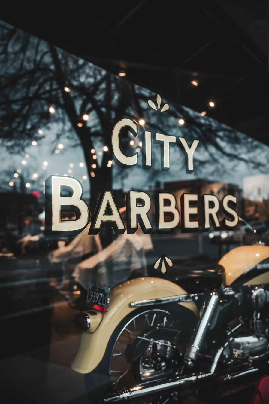 Gold City Barbers lettering on the shop’s front window in downtown Salt Lake City